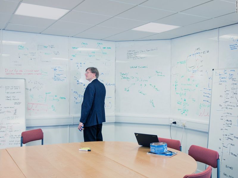Anders Sandberg stands by a whiteboard
